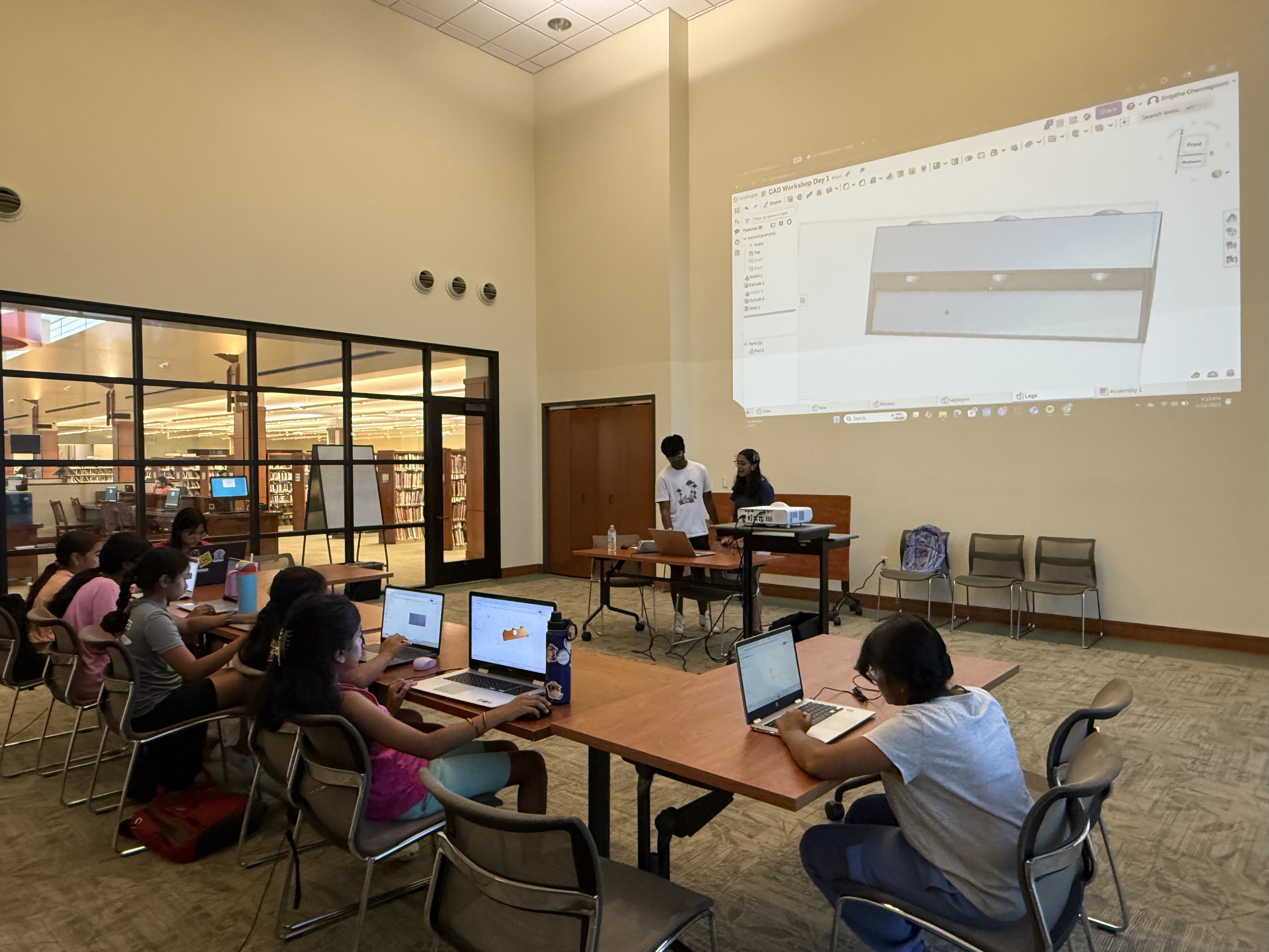 Students collaborating during our CAD workshop