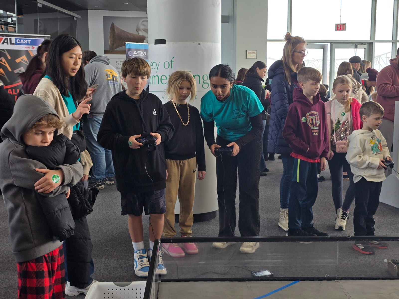 Students driving our robot at Engineering Day